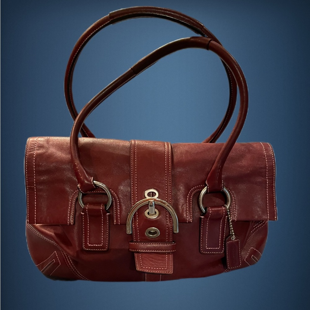 Coach satchel burgundy/wine color. Medium size. I’ll throw in the wallet